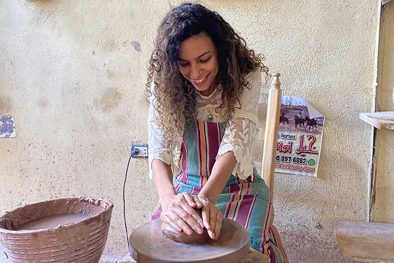 Kanzy Khafagy at the pottery wheel.
