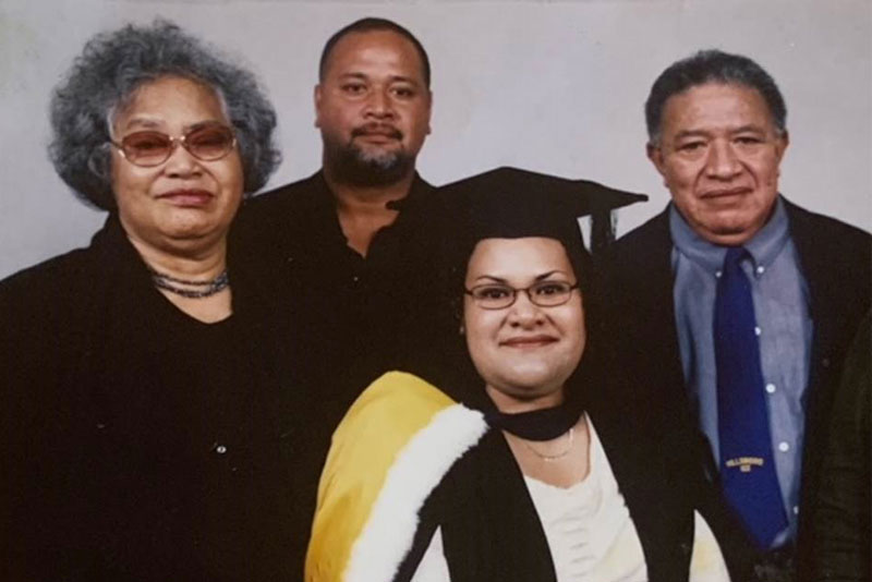 Lilika Fusimalohi with her parents and brother at her graduation.