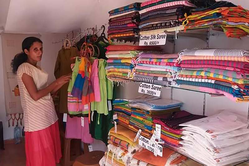 Owner of DHD Handlooms, Dilhani Iresha, with her handloom products.