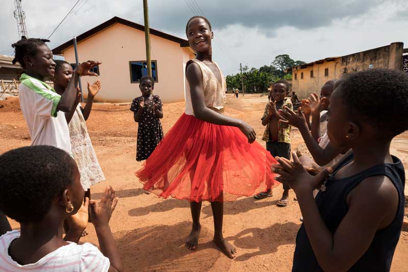 Children dance and play in the village of Essuehyia, Ghana.
