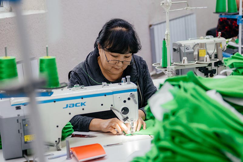 A woman working in a garment factory in Kyrgyz Republic..